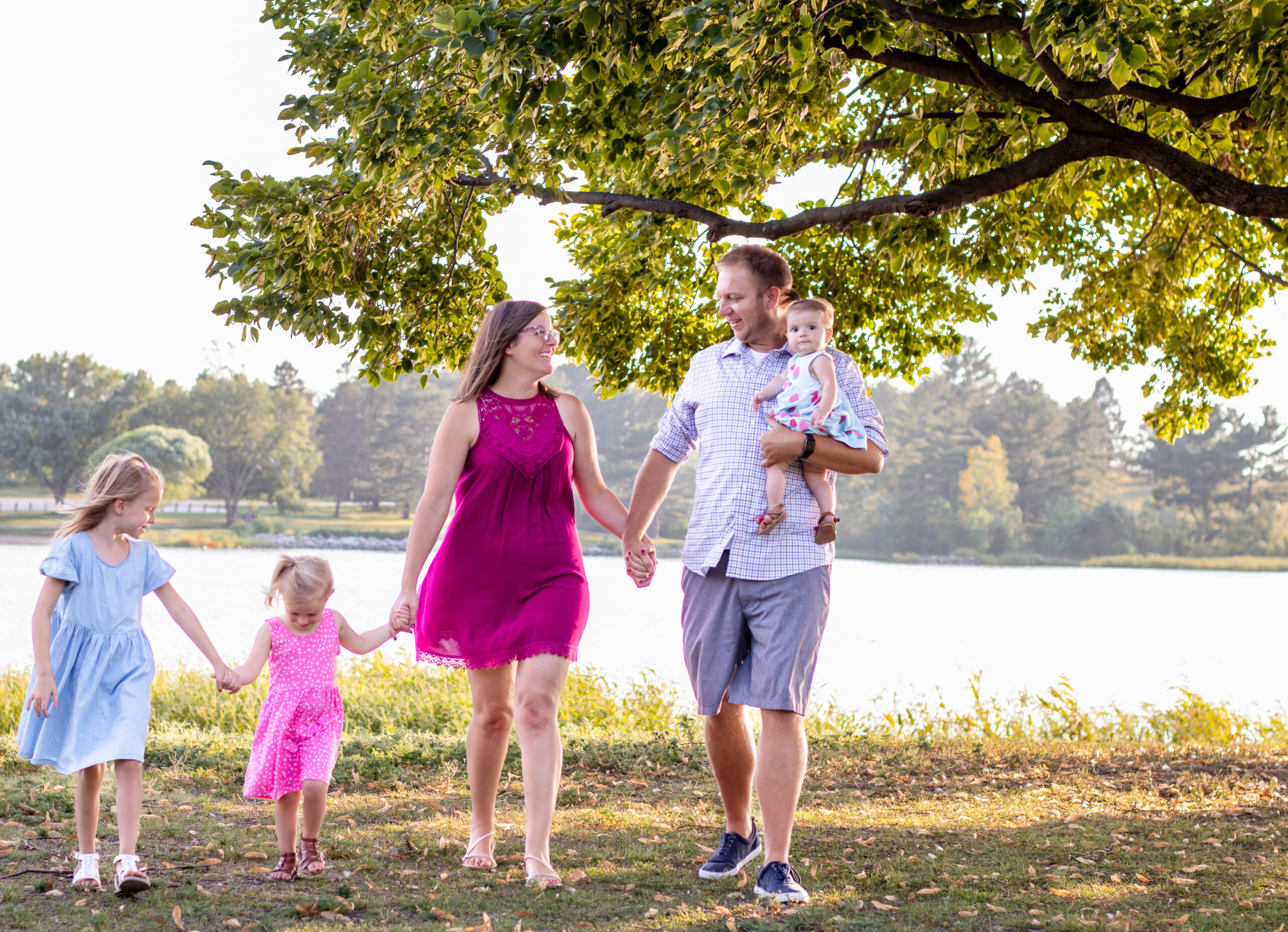 Family walking at Holmes Lake In Lincoln NE